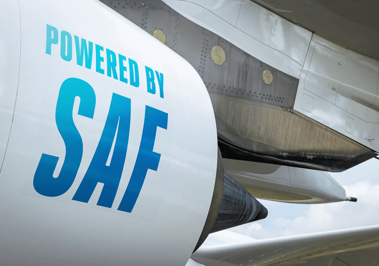 Close-up of an aircraft engine with 'Powered by SAF' text.